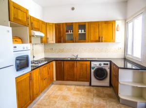 Kuchyň nebo kuchyňský kout v ubytování Mahdia Place Apartments