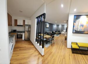 a kitchen and a living room with a dining room table at ABM house in Tangier