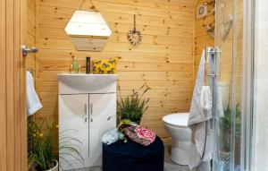 a bathroom with a toilet and a sink at Dwell on the Moor in Holme upon Spalding Moor