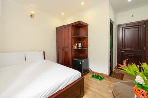 Posteľ alebo postele v izbe v ubytovaní Nguyên Hương Hotel