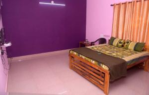 A bed or beds in a room at Yash Homestay