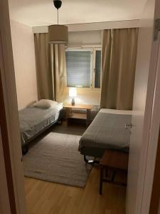 En eller flere senger på et rom på Liberty apartment Saarijarv 15/3