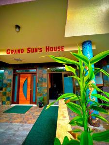 a grand suns house with a plant in front of it at GRAND SUN'S HOUSE in Puerto Baquerizo Moreno