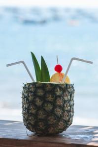 a pineapple with a cherry on top of it at Wiracocha Hostal Máncora - Surf Camp in Máncora