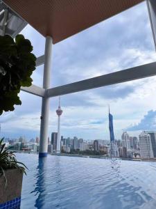 a swimming pool with a view of the city at Duplex 4px@Colony, Near Quill CityMall & Monorail in Kuala Lumpur