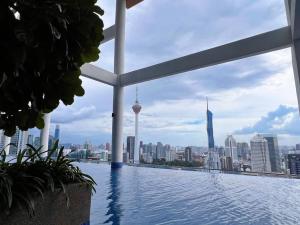 a swimming pool with a view of the city at Duplex 4px@Colony, Near Quill CityMall & Monorail in Kuala Lumpur
