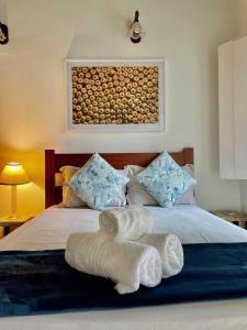 Ένα ή περισσότερα κρεβάτια σε δωμάτιο στο Suítes Tom Jobim