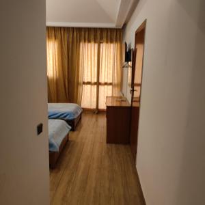 Двухъярусная кровать или двухъярусные кровати в номере Amrouss touristic DarMaroc