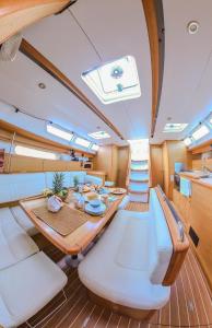 a dining room on a boat with a table at Private Sailingyacht "Guji" With Crew All Inclusive in Isla Wichitupo Grande