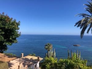 a view of the ocean from a villa at El jardin Botánico Villa LUZ in Altea