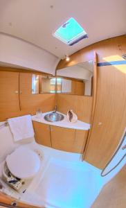 a bathroom with a sink and a toilet in a boat at Private Sailingyacht "Guji" With Crew All Inclusive in Isla Wichitupo Grande