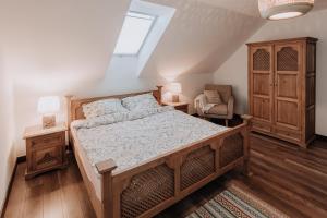 a bedroom with a large bed and a window at Stacja Jacnia in Jacnia
