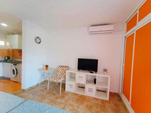 A television and/or entertainment centre at Agata Views