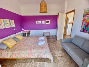 A bed or beds in a room at The Beachhouse Apartments