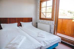 Säng eller sängar i ett rum på Hotel Luzern Engel