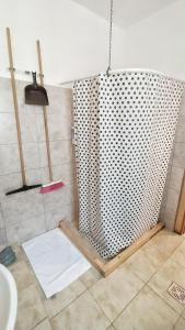 a shower in a bathroom with a shower curtain at Lavalle II in Venado Tuerto +3 photos