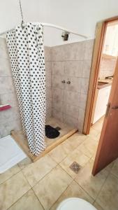 a bathroom with a shower with a toilet in it at Lavalle II in Venado Tuerto