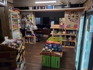 a store with a room filled with lots of products at The Queens Arms Hotel in Acomb