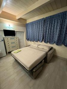 Postel nebo postele na pokoji v ubytování Civico 12 - casa vacanze + 11 fotografií
