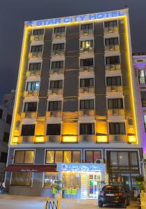 a building with a car parked in front of it at Star City Hotel in Istanbul