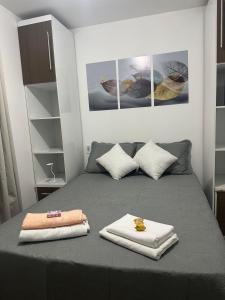 Postel nebo postele na pokoji v ubytování Cantinho Aconchegante - Quarto 01 AR-condicionado