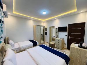 Voodi või voodid majutusasutuse Capital Of Pyramids Hotel toas