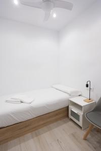 Säng eller sängar i ett rum på Chic Central Madrid
