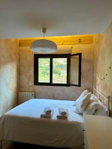 Łóżko lub łóżka w pokoju w obiekcie EL BALCÓN PANORÁMICO DE GREDOS