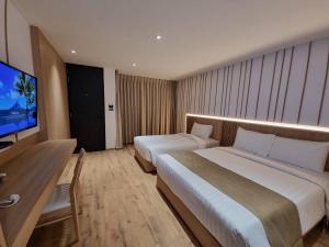 Postel nebo postele na pokoji v ubytování Nirundorn Resort Chaam
