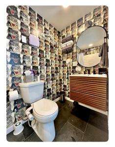 a bathroom with a toilet and a mirror at Nomehaus shipping container studio residential neighborhood ATHENS in Athens