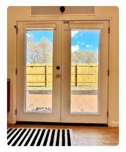 an open door with a view of a deck at Nomehaus shipping container studio residential neighborhood ATHENS in Athens