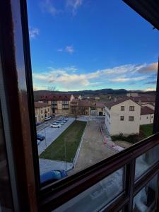 a view from a window of a parking lot at El rincón acogedor in Medina de Pomar