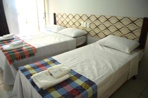 Canoas Hotel客房内的一张或多张床位
