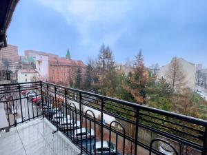 a balcony with a view of a city at URBAN APARTMENTS PREMIUM No12, Free Parking, Self Check-in in Chorzów