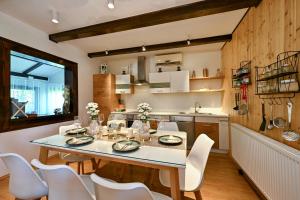 a kitchen and dining room with a table and chairs at Holiday House Sunny Hill in Veliko Trgovišće