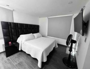 Postel nebo postele na pokoji v ubytování Casa vacacional en Pereira + 37 fotografií