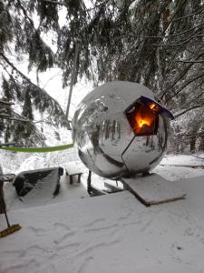 a snow globe with a light in it in the snow at Chalet F'Net in Saint-Gervais-les-Bains