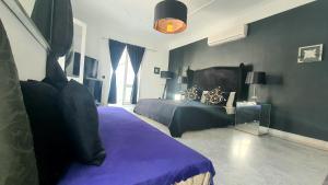 Postel nebo postele na pokoji v ubytování Riad VIP Bed & Breakfast