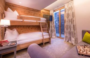 Voodi või voodid majutusasutuse Circle Chalets Arlberg toas