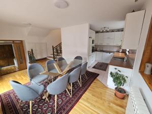 a kitchen and dining room with a table and chairs at Villa Anni in Sarajevo +60 photos