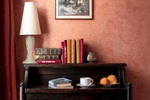 a table with books and a lamp and eggs on it at La Maison de Tanger in Tangier