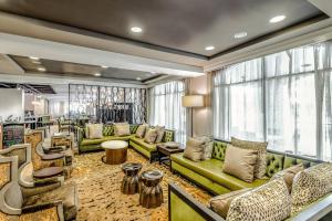 a living room with couches and chairs in a store at Courtyard by Marriott Charleston Historic District in Charleston