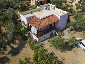 an overhead view of a house with a roof at Nice villa on small beautiful complex of 3 villas communal pool NW coast in Pangalochori