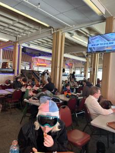 a group of people sitting at tables in a restaurant at Cozy 4BR Ski retreat and Water Park! in Massanutten