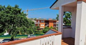 a view of a city from the balcony of a house at Brezza di Mare - Casa Casoni in Marcelli +2 photos