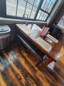 a desk in a room with a sink and a toilet at Luxe Art Gallery in Saint Louis