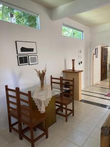 a dining room with a table and chairs at Casa da Cristina in Trancoso