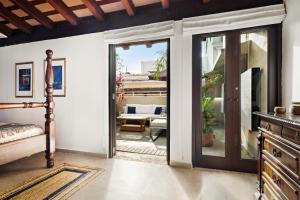 a room with sliding doors leading to a patio at Tizol Historic Building 8br in Old San Juan in San Juan