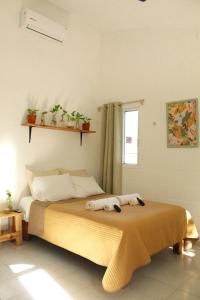 Tempat tidur dalam kamar di Casa Palmita