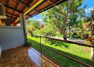 a balcony with a view of a yard at Pousada Recanto Oriental in Palmas